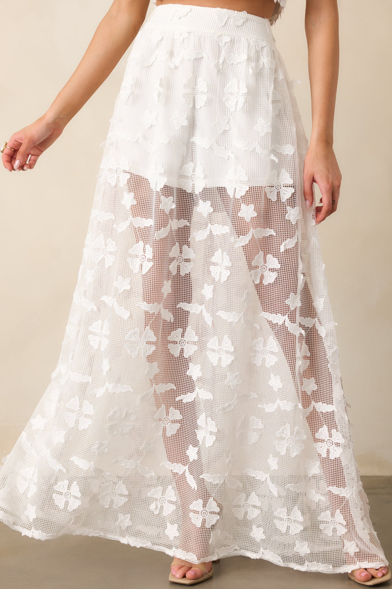 A closer look at the sheer midi overlay, creating a soft and ethereal layered effect.