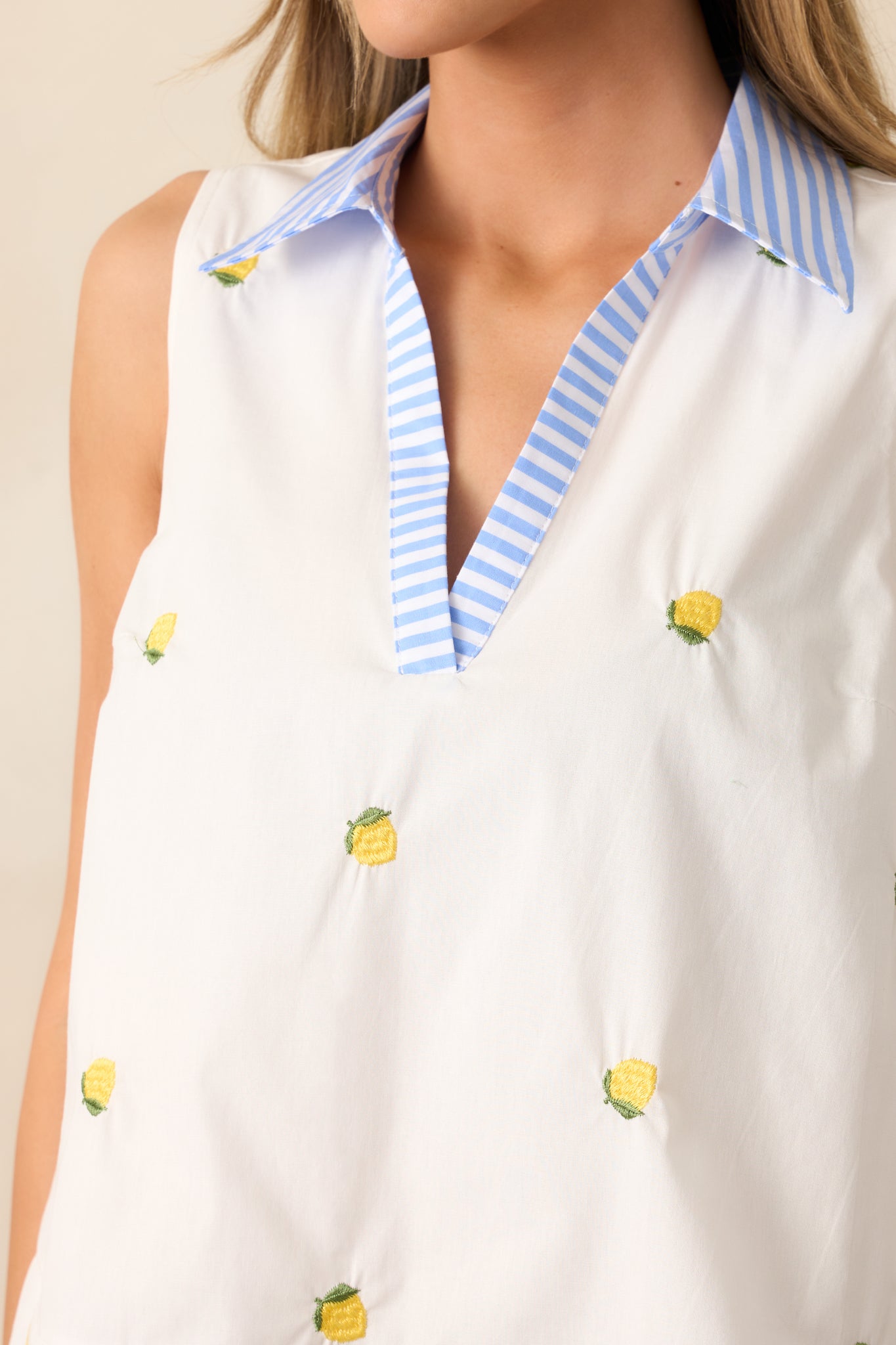 A detailed view of the lemon print, showcasing the bright and zesty design that adds charm to the ivory blouse.