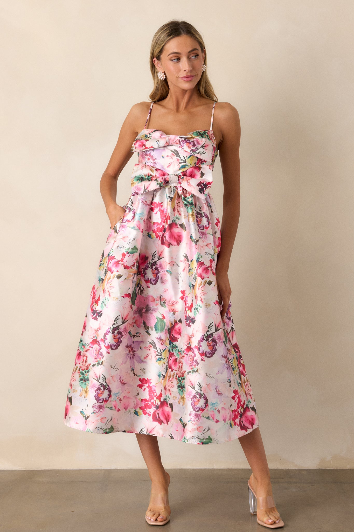 A front-facing view of the dress, emphasizing the fit-and-flare design and the vibrant floral print spread across the fabric.