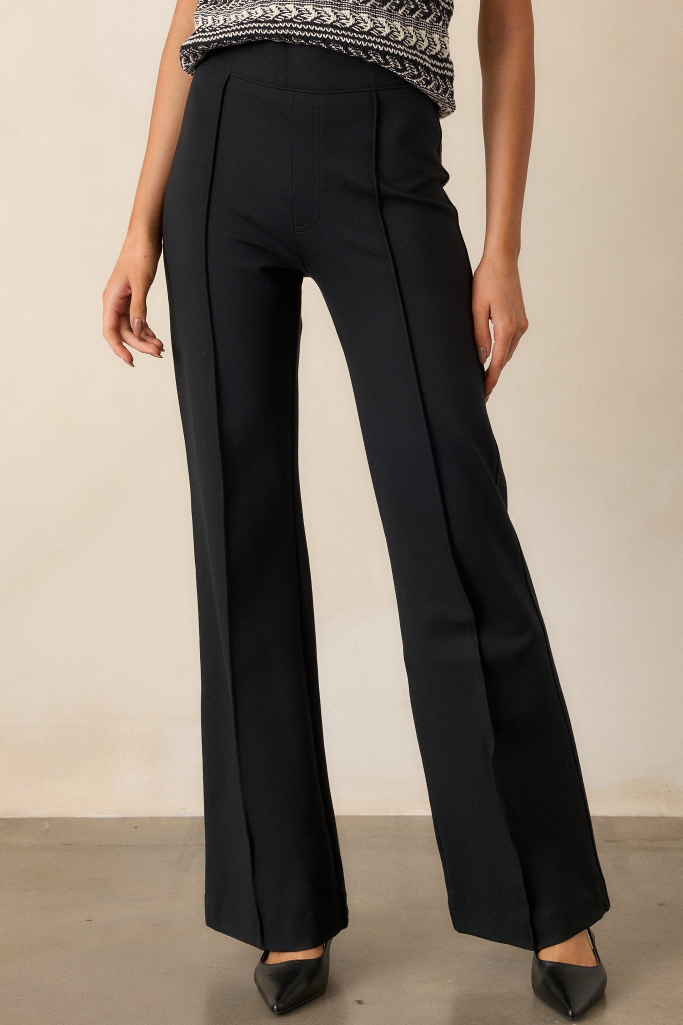 Full view of the stretchy premium ponte fabric pants, showcasing the pull-on design that sits at the natural waist, displayed against a plain background.