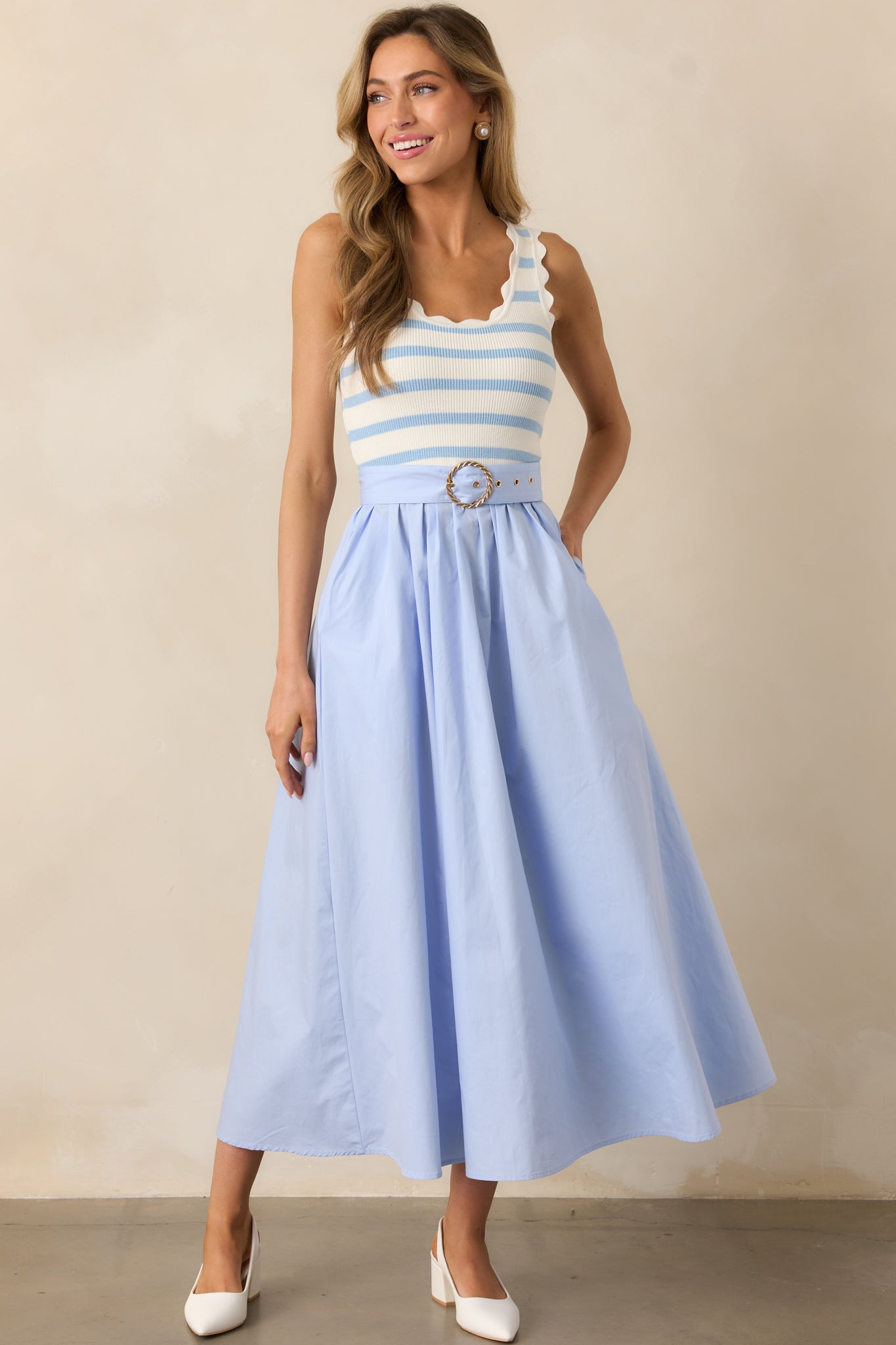 Blue midi dress with a striped knit top and scalloped hems, creating a charming and unique contrast.