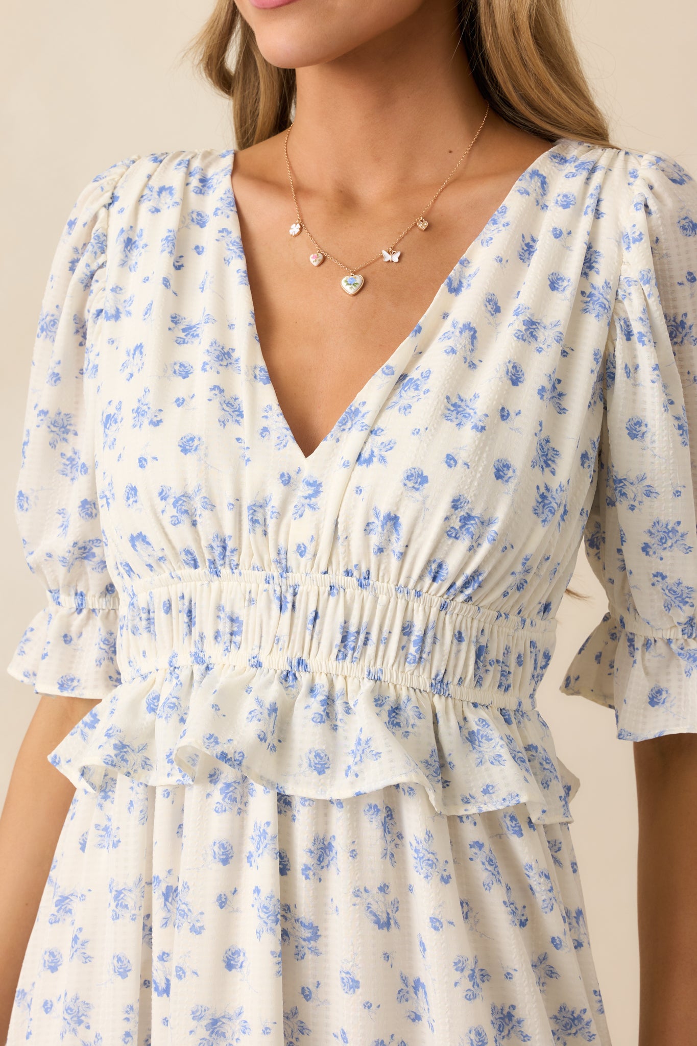 A detailed look at the ruffled elastic cuffs, highlighting the delicate fabric and floral pattern.